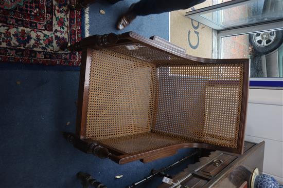 A George III mahogany Bergere with leather squab